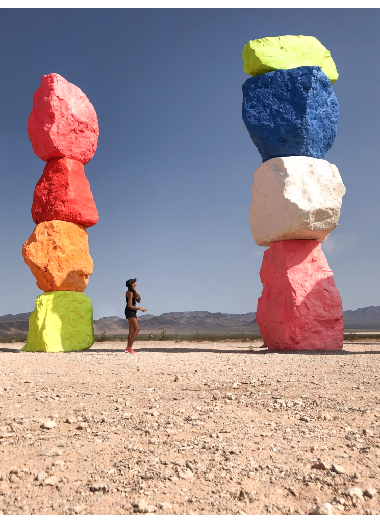 Girl standing in front of the seven magic mountains