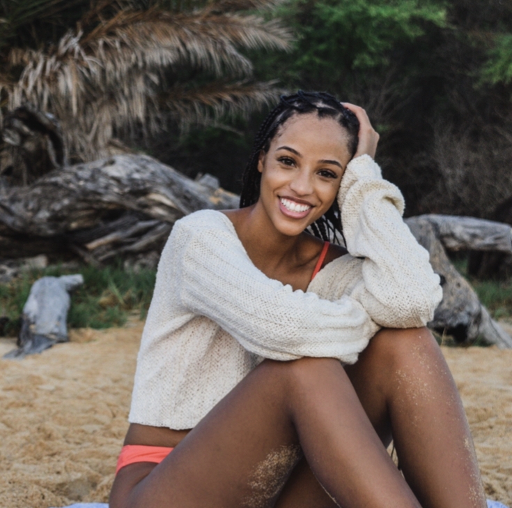 girl sitting on the beach