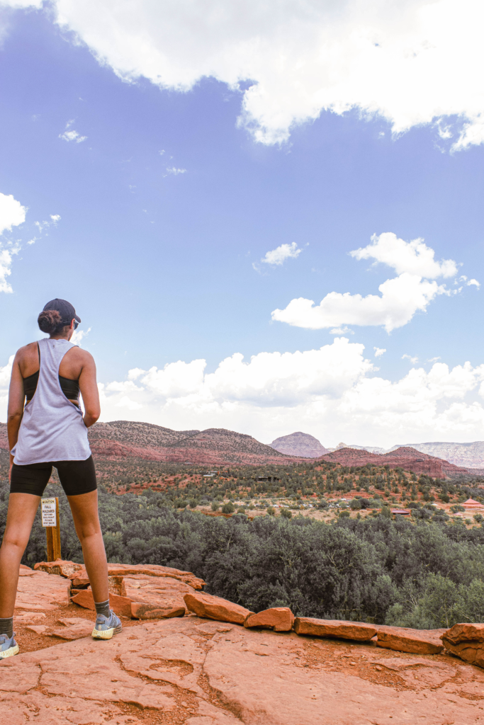 Girl standing on the scenic overlook of eagles nest in Sedona az